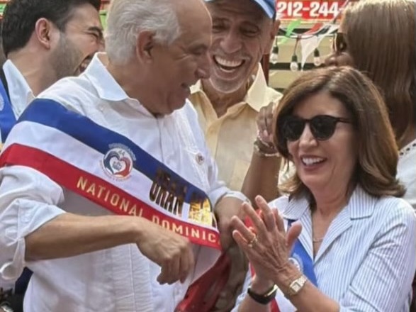 Grand Marshal and New York Governor Kathy Hochul wearing custom National Dominican Day Parade sashes